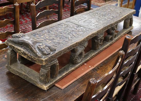 An early 20th century Cameroon carved wood childs bed w.145cm